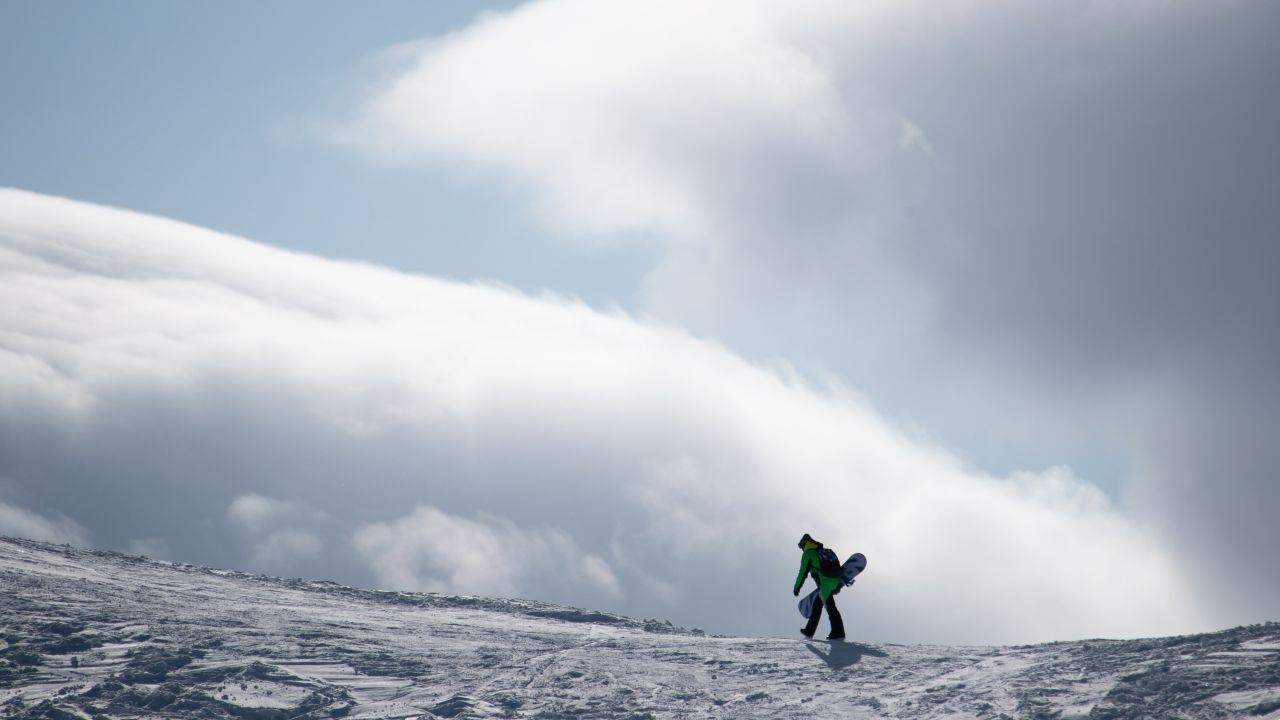 <strong>Dombay, Russia: </strong>A snowboarder ambles on a slope at Mount Mussa-Achitara in Dombay, a year-round resort known for its top skiing and hiking trails.