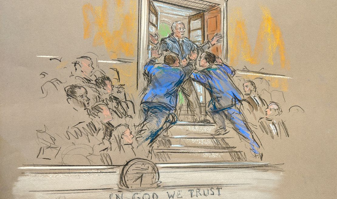 A protestor briefly interrupts the trial on January 22. 