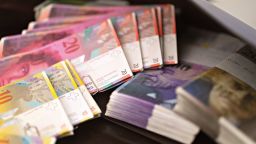 Swiss Franc banknotes sit in the office of a bank in this arranged photograph in Zurich, Switzerland, on Friday, Nov. 20, 2015. The franc is still too strong and the economy not yet back to full health, Swiss National Bank Governing Board member Andrea Maechler said.
