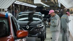 This picture taken on February 1, 2016 shows Chinese employees working on the Kadjar car assembly line of France's Renault and China's Dongfeng Group factory in Wuhan, Hubei province.