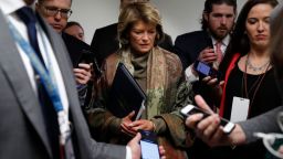 Sen. Lisa Murkowski, R-Alaska, declines to answer questions from reporters as she walks, Wednesday, Jan. 22, 2020, on Capitol Hill in Washington. The U.S. Senate has begun hearing opening arguments in President Donald Trump's impeachment trial with proceedings now on a fast track. (AP Photo/ Jacquelyn Martin)