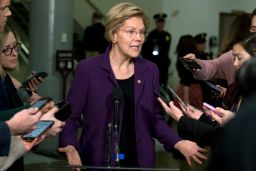 Sen. Elizabeth Warren,  talks to the media as she walks to the Senate chamber prior to the start of the impeachment trial. 
