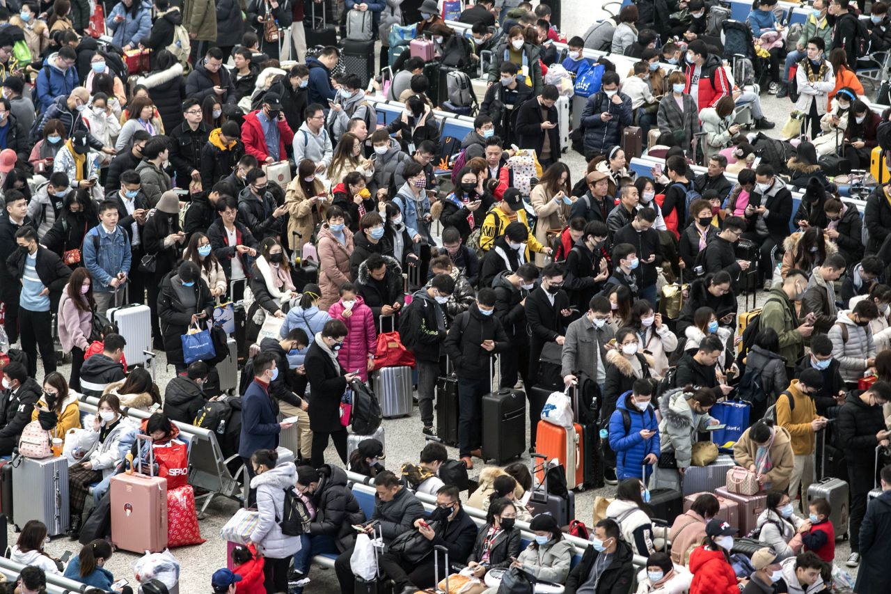 Swarms of travelers wait for transport at the Hongqiao high-speed railway station in Shanghai on Wednesday, January 22.