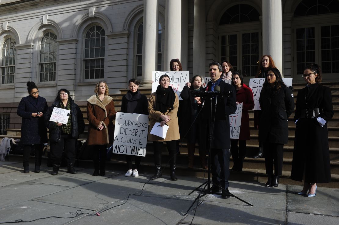 Marissa Hoechstetter, center, and her attorney, Anthony DiPietro, at the microphone, joined supporters Thursday at New York's City Hall to call for the resignation of Manhattan District Attorney Cyrus Vance.