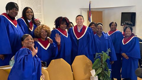 Yang posing with choir members for a photo last Sunday.
