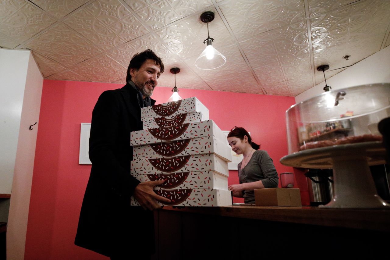 Canadian Prime Minister Justin Trudeau carries boxes out of the Oh Doughnuts shop in Winnipeg. <a href="https://www.cnn.com/2020/01/22/politics/justin-trudeau-doughnut-shop-prices/index.html" target="_blank">Trudeau tweeted the photo</a> on Monday, January 20, and said: "Picked up some of Winnipeg's best to keep us going through another full day of Cabinet meetings. Thanks for the fuel, @OhDoughnuts. #shoplocal." Some rushed to praise the Prime Minister, celebrating his support for a local business. Others criticized him for what they viewed as an overly "expensive" doughnut purchase.