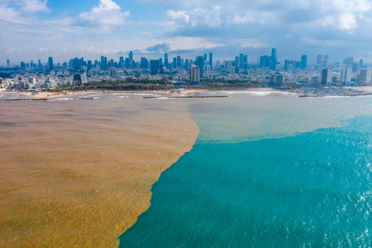 Mud water from the Yarkon River flows into the Mediterranean Sea in Tel Aviv, Israel, on Wednesday, January 22.