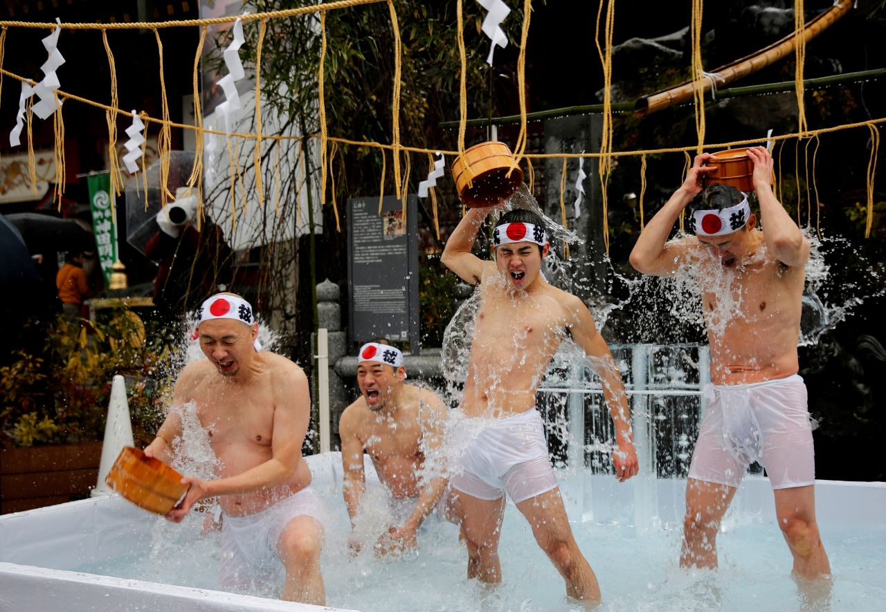 Men splash themselves with cold water during an annual endurance ceremony to purify their souls and wish for good fortune in the new year at the Kanda Myojin shrine in Tokyo on Saturday, January 18.