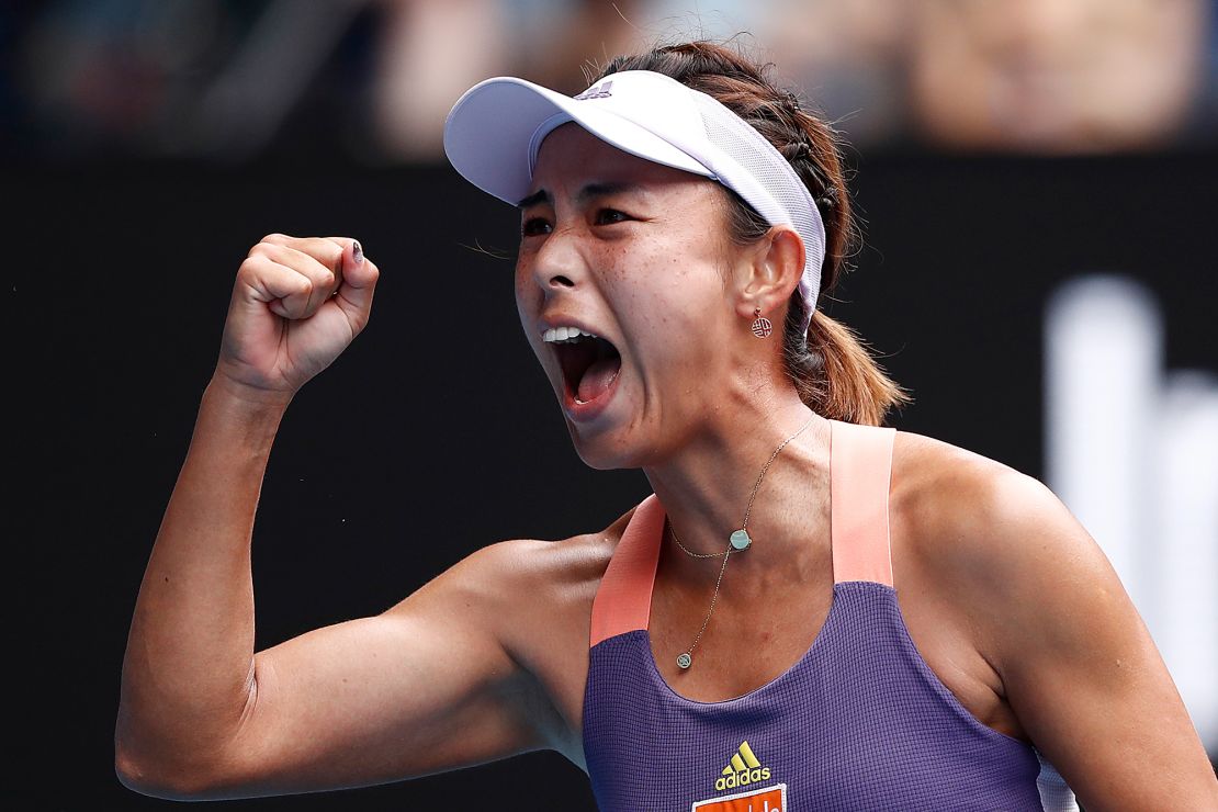 Qiang Wang of China celebrates after winning a point.