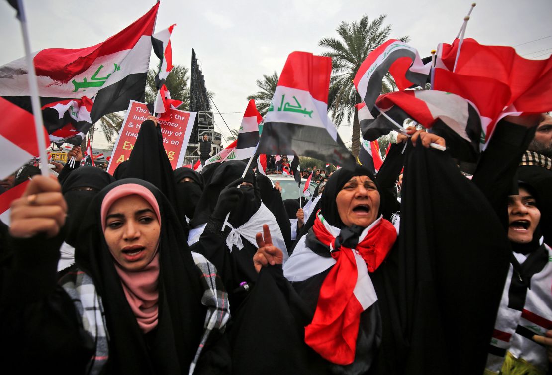 Women shout slogans at the protest in Baghdad against the US military presence in Iraq. 