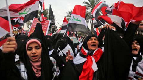 Women shout slogans at the protest in Baghdad against the US military presence in Iraq. 