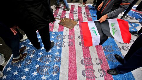 Protesters step on a makeshift US flag after heeding the call of powerful Shia cleric Muqtada al-Sadr for a "Million Man March." 
