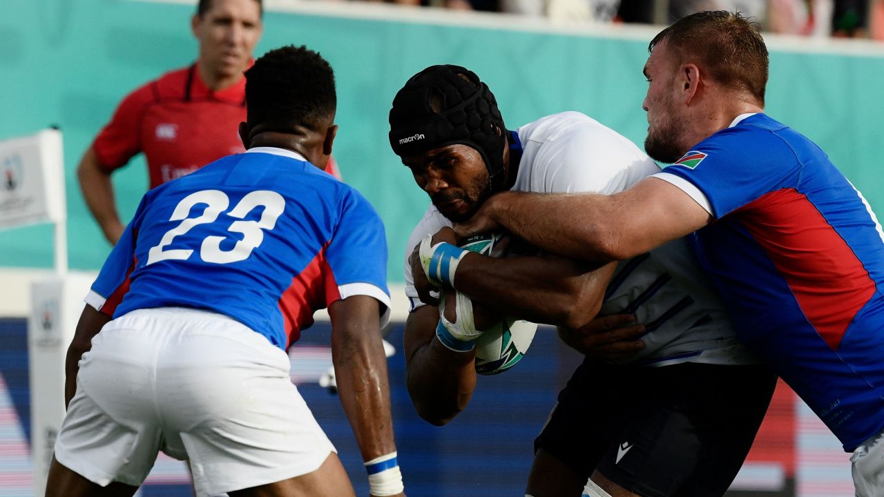 Mbanda is tackled during the Rugby World Cup match between Italy and Namibia.