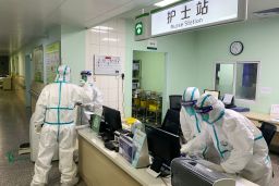 This photo taken on January 22, 2020 shows medical staff members wearing protective suits at the Zhongnan hospital in Wuhan in China's central Hubei province. 
