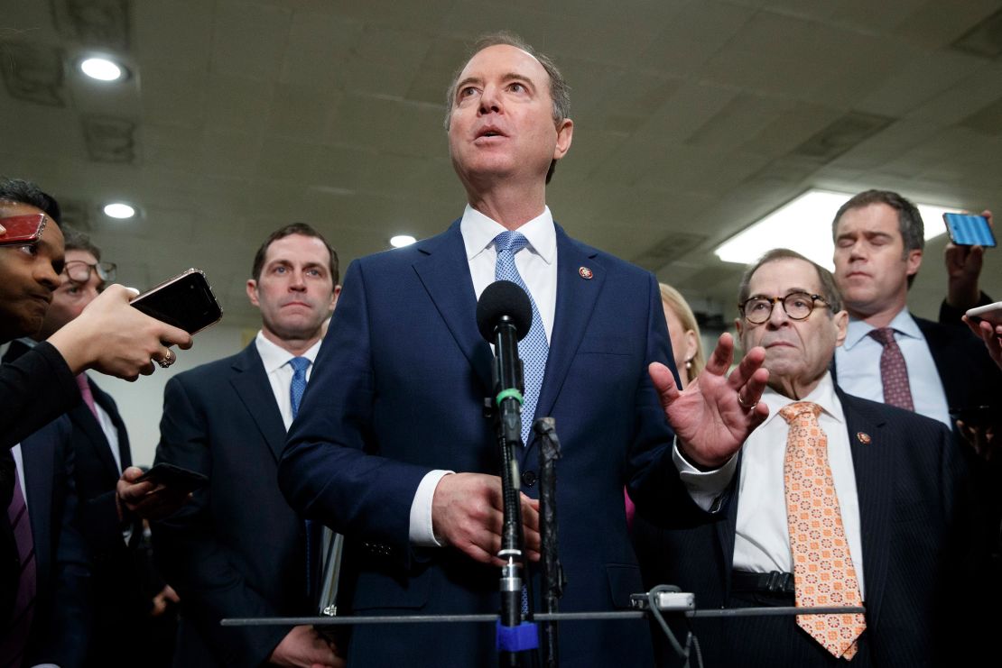 Crow is seen standing behind and to the left of lead impeachment manager Rep. Adam Schiff of California, as well as House Judiciary Committee Chairman Jerry Nadler, bottom right, at a news conference Friday on Capitol Hill in Washington.