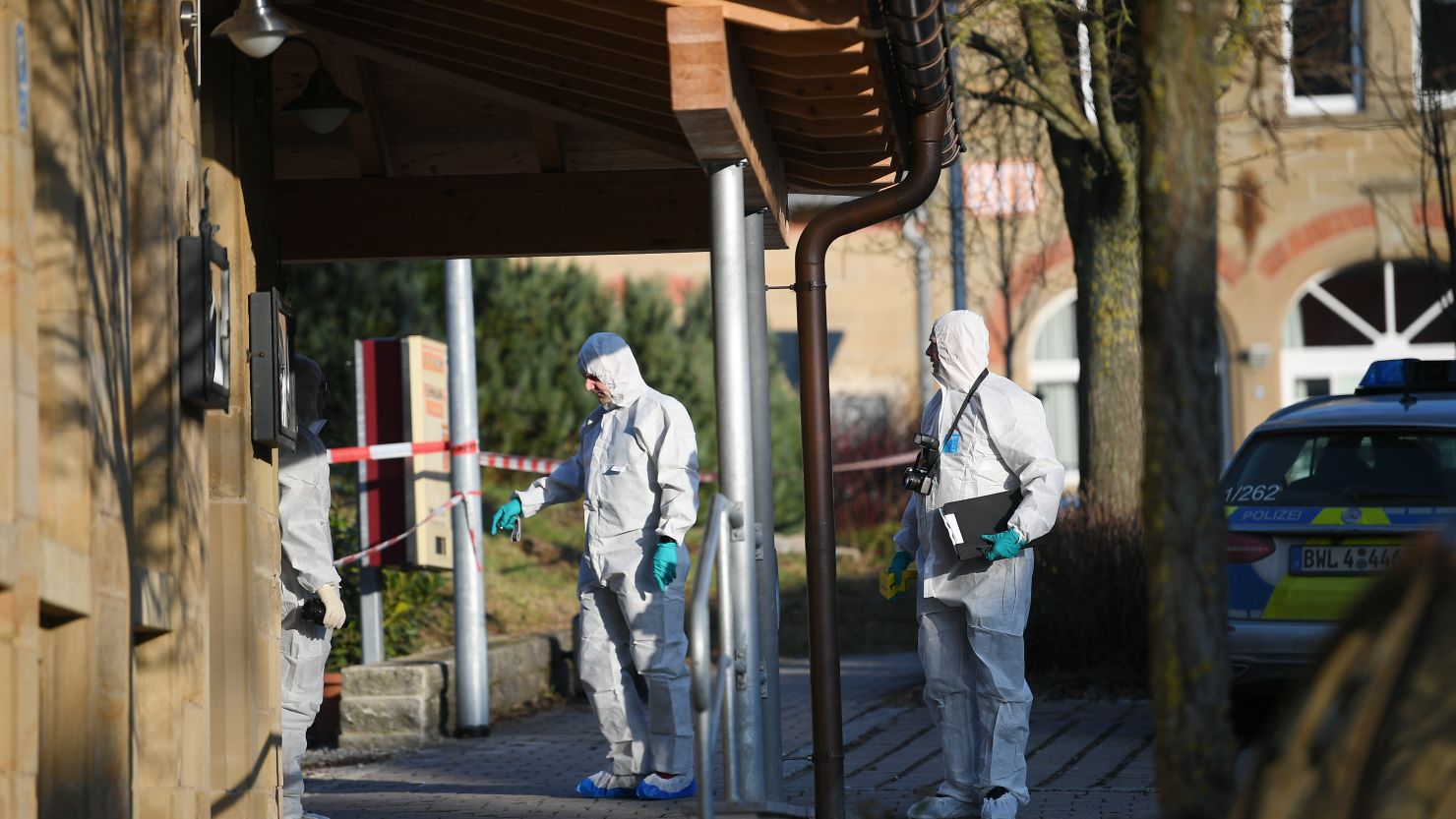 Forensic police officers investigate the shooting in Rot am See, Germany.