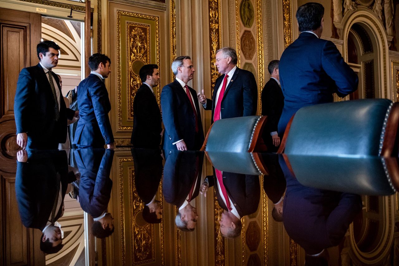 White House Counsel Pat Cipollone, center left, talks with US Rep. Mark Meadows as he prepares to leave a meeting room with the rest of President Trump's defense team on January 24.