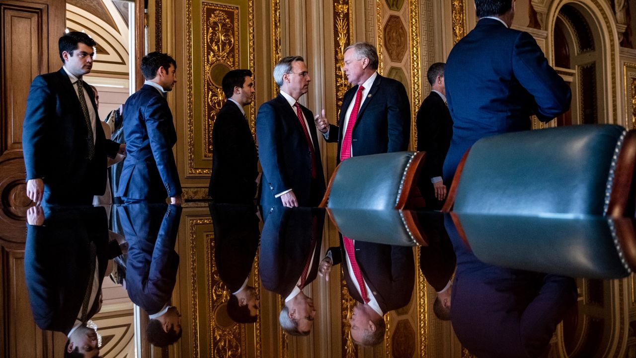 White House Counsel Pat Cipollone (center left) and Representative Mark Meadows (R-NC) (center right) as they leave their meeting with the rest of President Donald Trump's defense team
