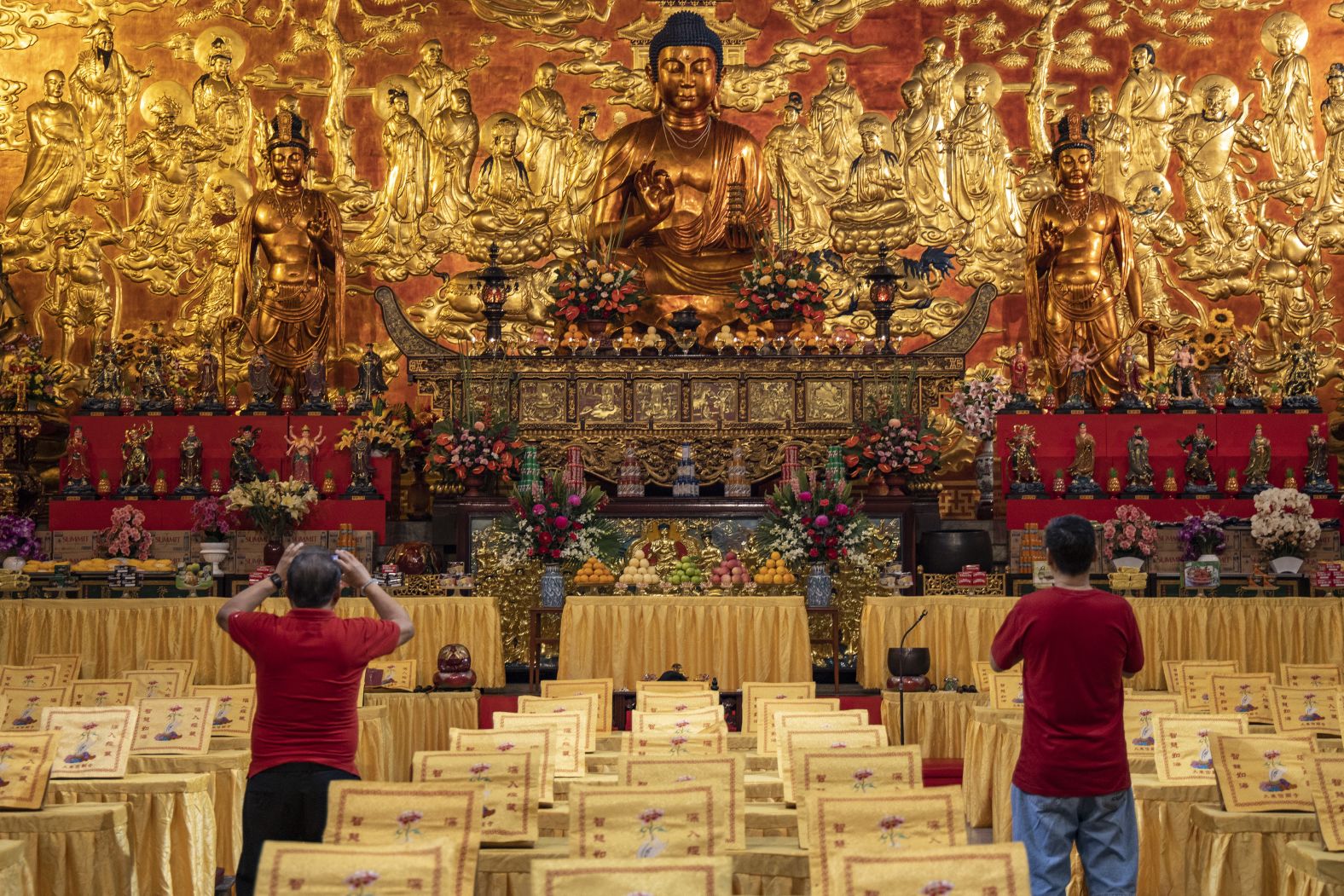 Temple-goers take pictures at Seng Guan Temple on the eve of the Chinese New Year on Friday, January 24, in Manila, Philippines.