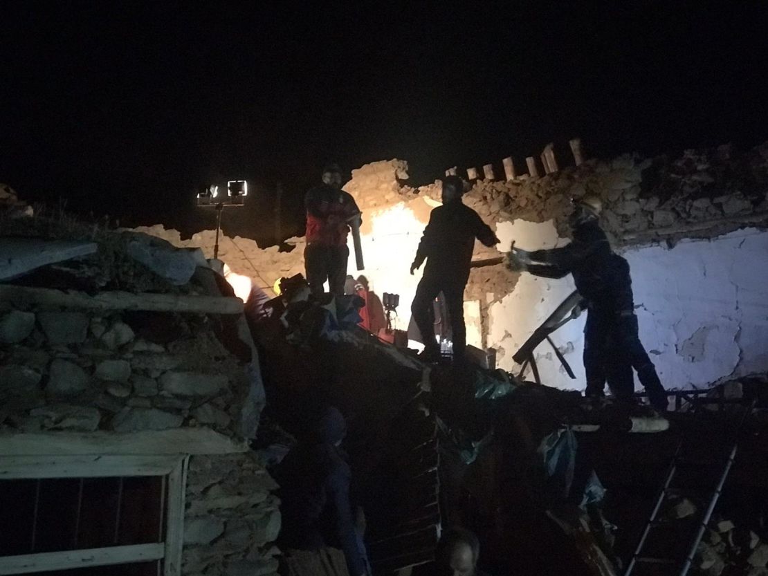Teams conduct search operations for survivors of a collapsed building in Malatya province.