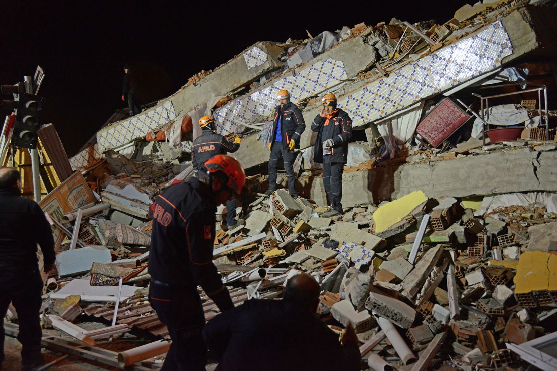 Turkish rescue and police work at the scene of a collapsed building in Elazig following a 6.8 magnitude earthquake in eastern Turkey, on January 24, 2020. 