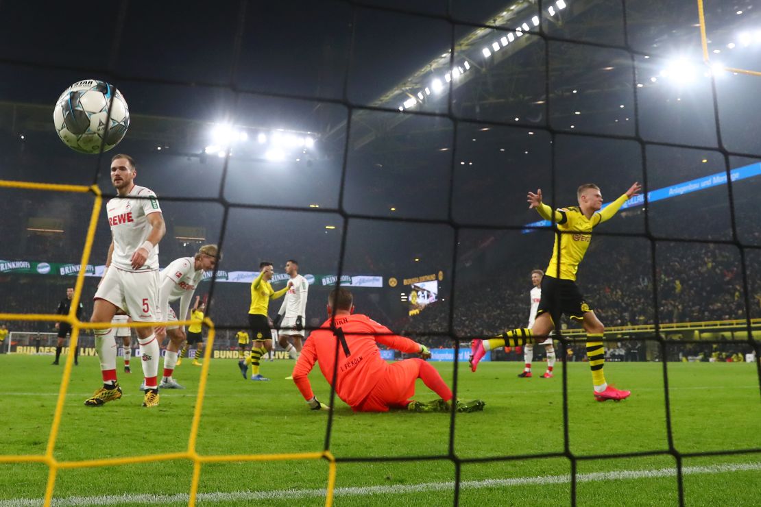 Håland celebrates after scoring  Dortmund's fourth goal against Koln.