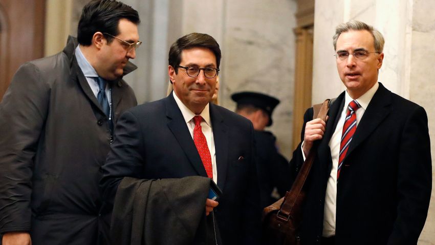 President Donald Trump's personal attorney Jay Sekulow, center, stands with his son, Jordan Sekulow, left, and White House Counsel Pat Cipollone, while arriving at the Capitol in Washington during the impeachment trial of President Donald Trump on charges of abuse of power and obstruction of Congress, Saturday, Jan. 25, 2020. (AP Photo/Julio Cortez)