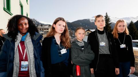 Climate activists Vanessa Nakate, Luisa Neubauer, Greta Thunberg, Isabelle Axelsson and Loukina Tille, from left, arrive for a news conference in Davos. The AP news agency apologized for earlier publishing an image with Nakate cropped out. 