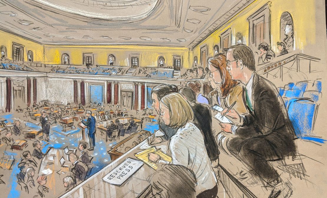 Trump attorney Pat Cipollone speaks as reporters watch at the Senate impeachment trial; January 25, 2020