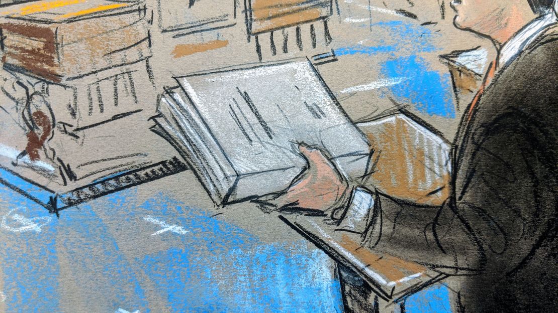 Trump attorney Jay Sekulow holding the Mueller report at the Senate impeachment trial; January 24, 2020