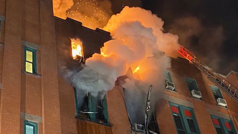 At least 200 New York City firefighters battled the raging blaze at the building in the city's Chinatown area Thursday night.