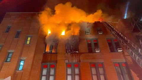 The fire began on the building's fourth floor and spread to the roof, fire officials said.
