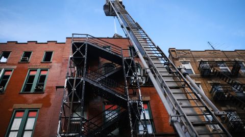 Firefighters continue to work in New York's Chinatown on Friday after a fire Thursday evening severely damaged a historic building that has been home to a museum, a senior center and other nonprofits for decades.