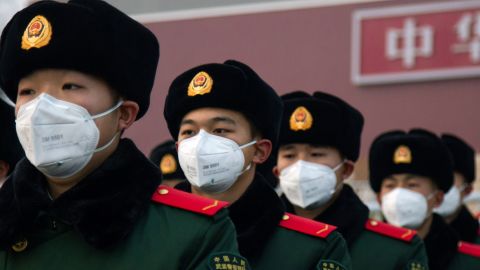 Chinese police officers stand in front of the Tiananmen Gate in Beijing, China.