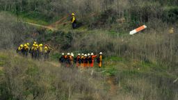 Firefighters work the scene of a helicopter crash where former NBA star Kobe Bryant died, Sunday, Jan. 26, 2020, in Calabasas, Calif. (AP Photo/Mark J. Terrill)