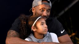IRVINE, CA - JULY 26:  Kobe Bryant and daughter Gianna Bryant watch during day 2 of the Phillips 66 National Swimming Championships at the Woollett Aquatics Center on July 26, 2018 in Irvine, California.  (Photo by Harry How/Getty Images)