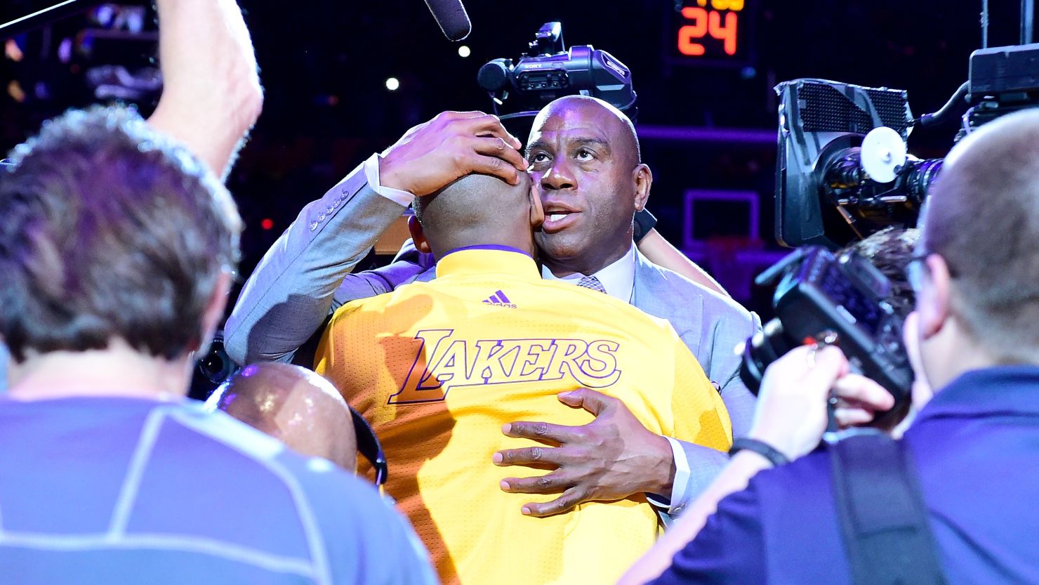 Earvin 'Magic' Johnson hugs Kobe Bryant #24 of the Los Angeles Lakers before a game against the Utah Jazz in April 2016.