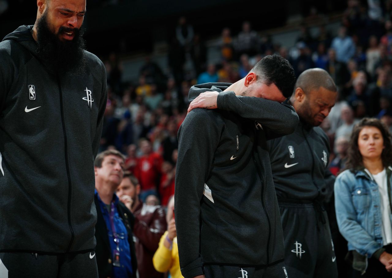 From left, Houston Rockets players Tyson Chandler, Austin Rivers and P.J. Tucker react during a tribute to Kobe Bryant before their game against the Denver Nuggets on Sunday, January 26.