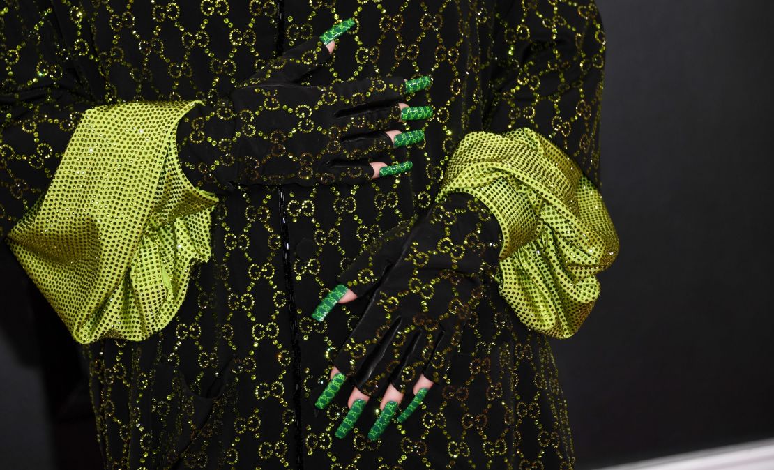 Close up of Billie Eilish's Gucci-branded green nails.