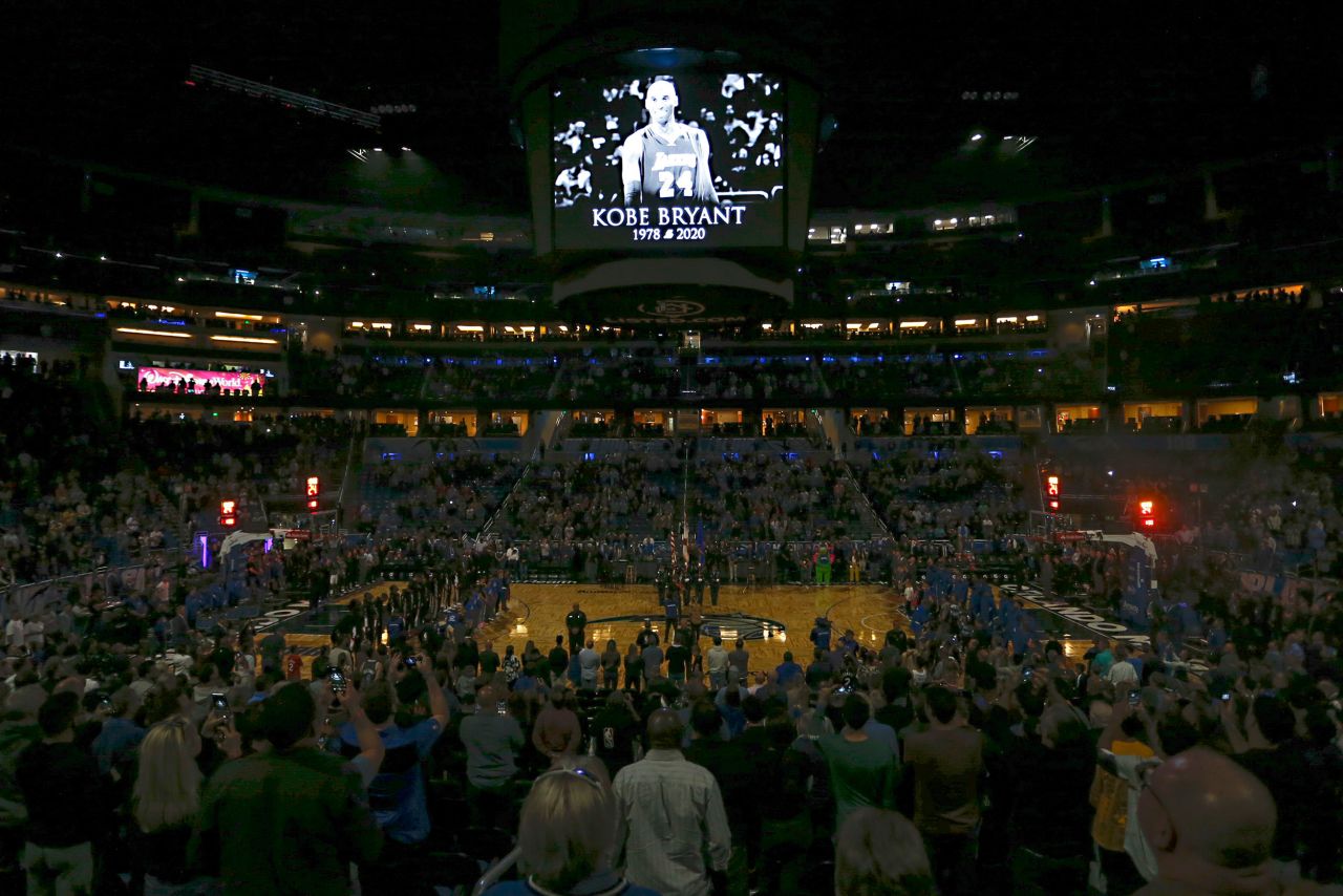 Fans stand for a moment of silence before the game between the Orlando Magic and the LA Clippers in Orlando on Sunday.