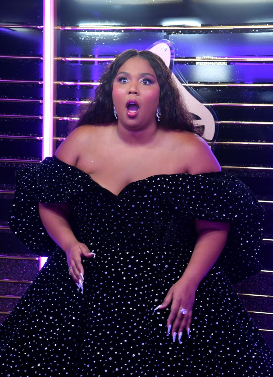 Lizzo reacts backstage after winning best pop solo performance for her song "Truth Hurts."