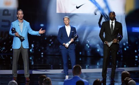From left, Peyton Mannin,  Abby Wambach and Bryant accept the Icon Award during the 2016 ESPYS at Microsoft Theater in Los Angeles.