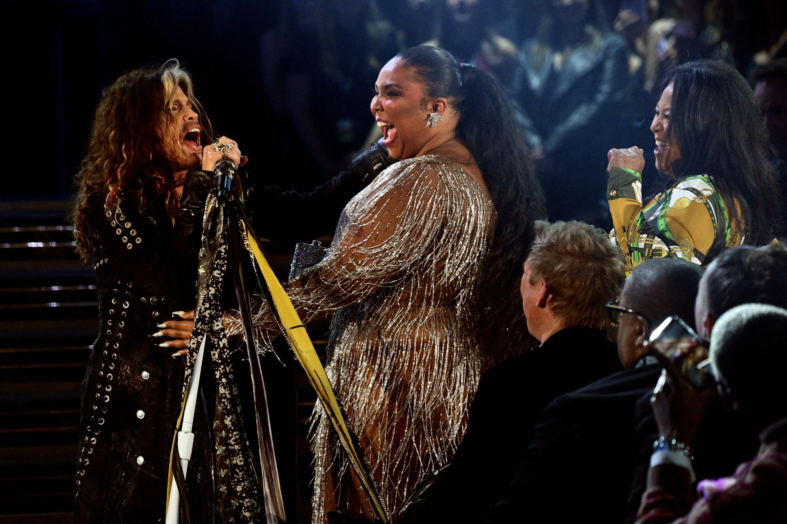Steven Tyler and Lizzo perform onstage. 
