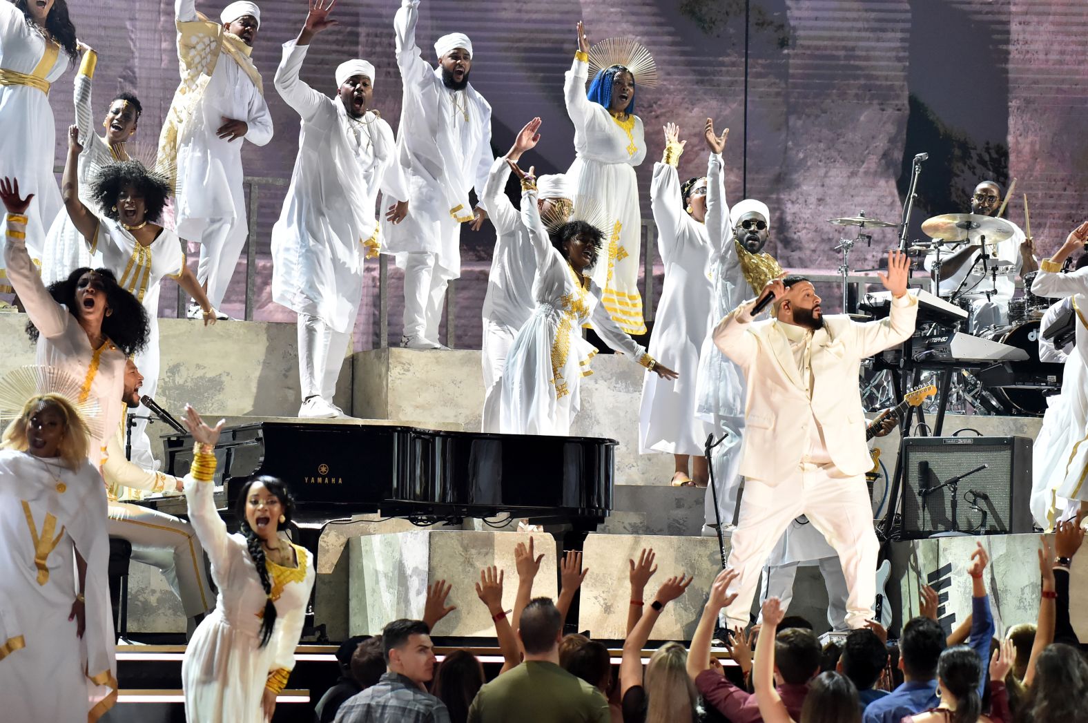 John Legend and DJ Khaled perform onstage.