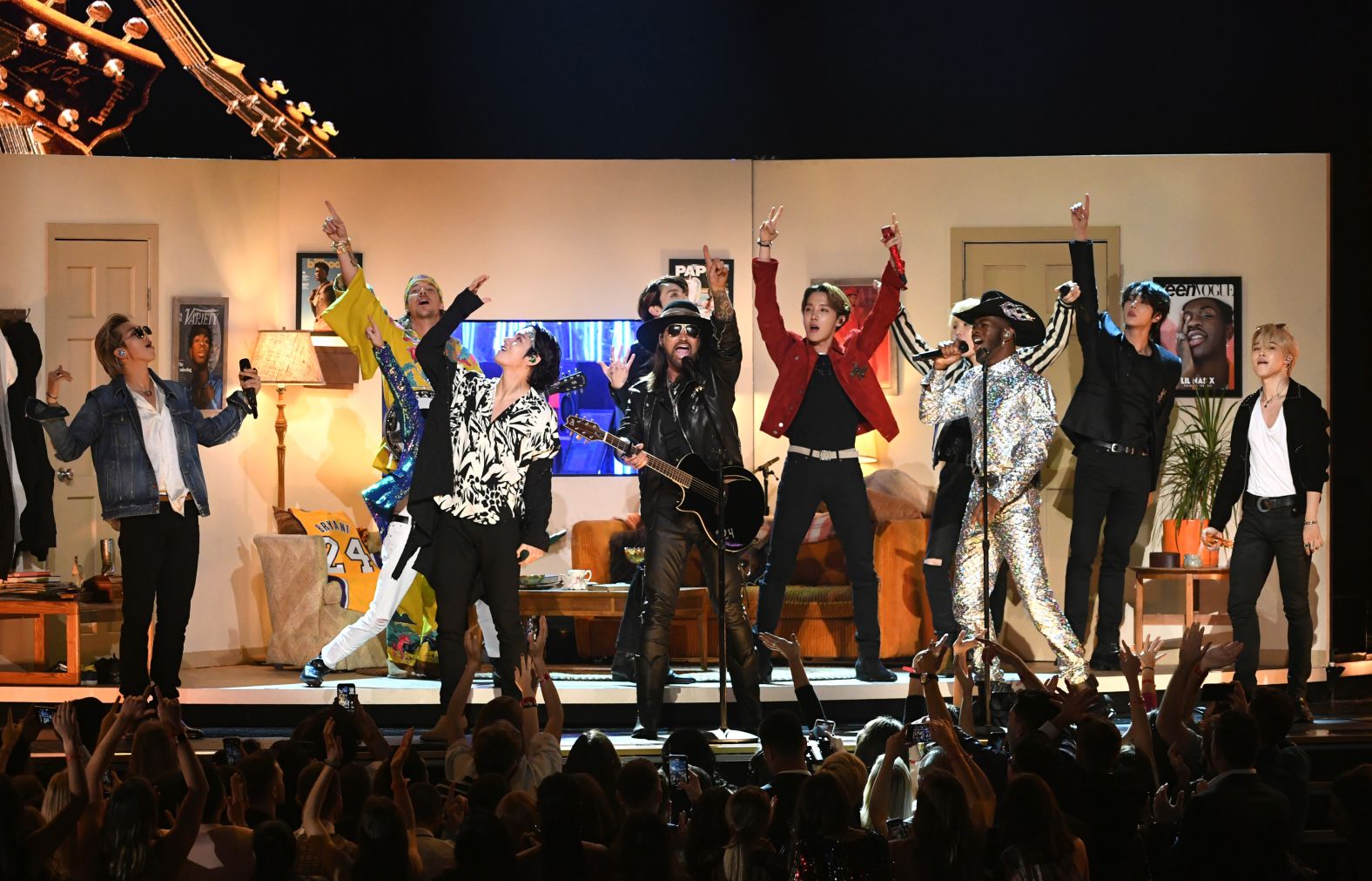 Billy Ray Cyrus, Lil Nas X, and BTS perform together. 