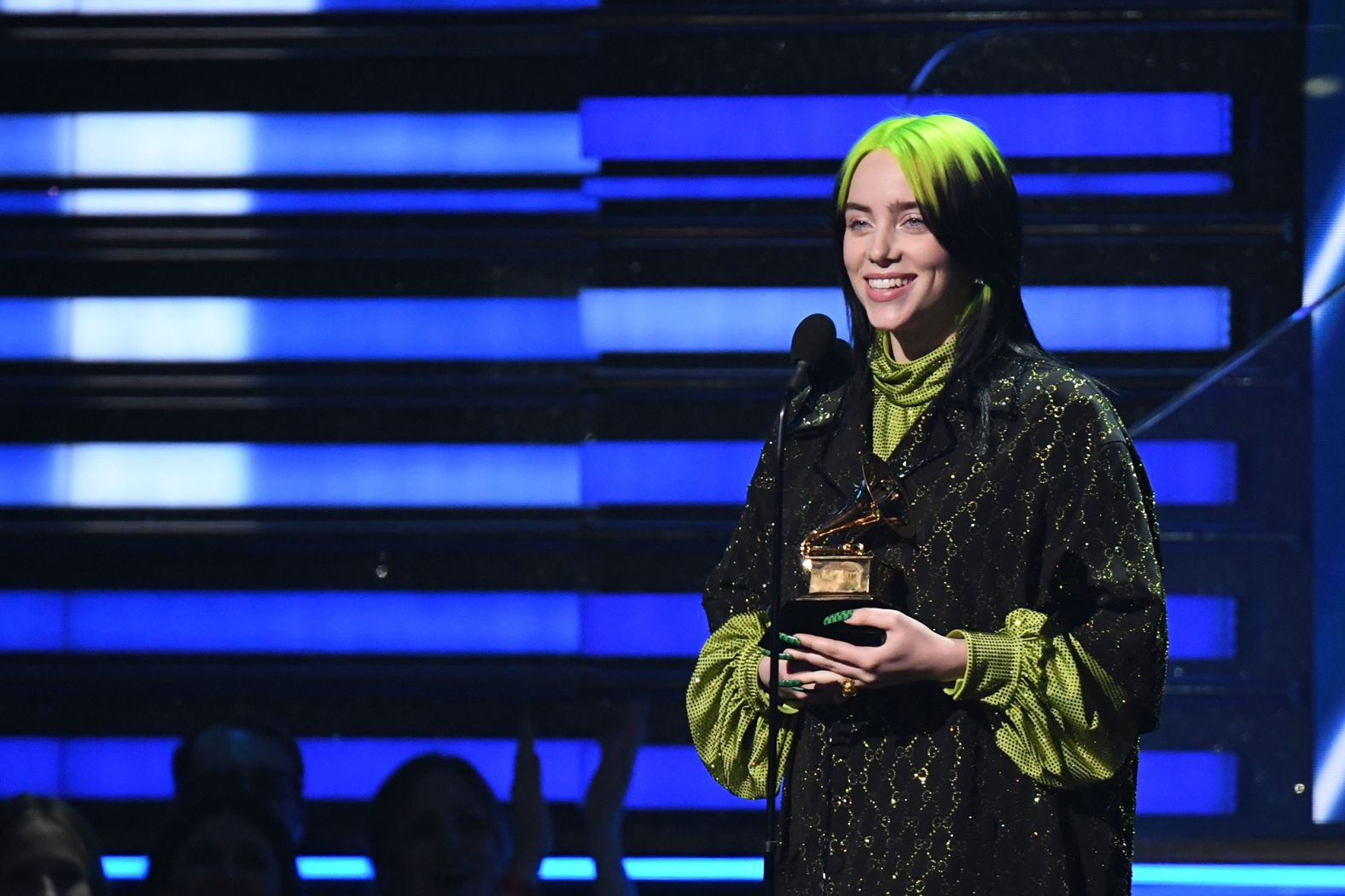 Billie Eilish receives the award for song of the year.