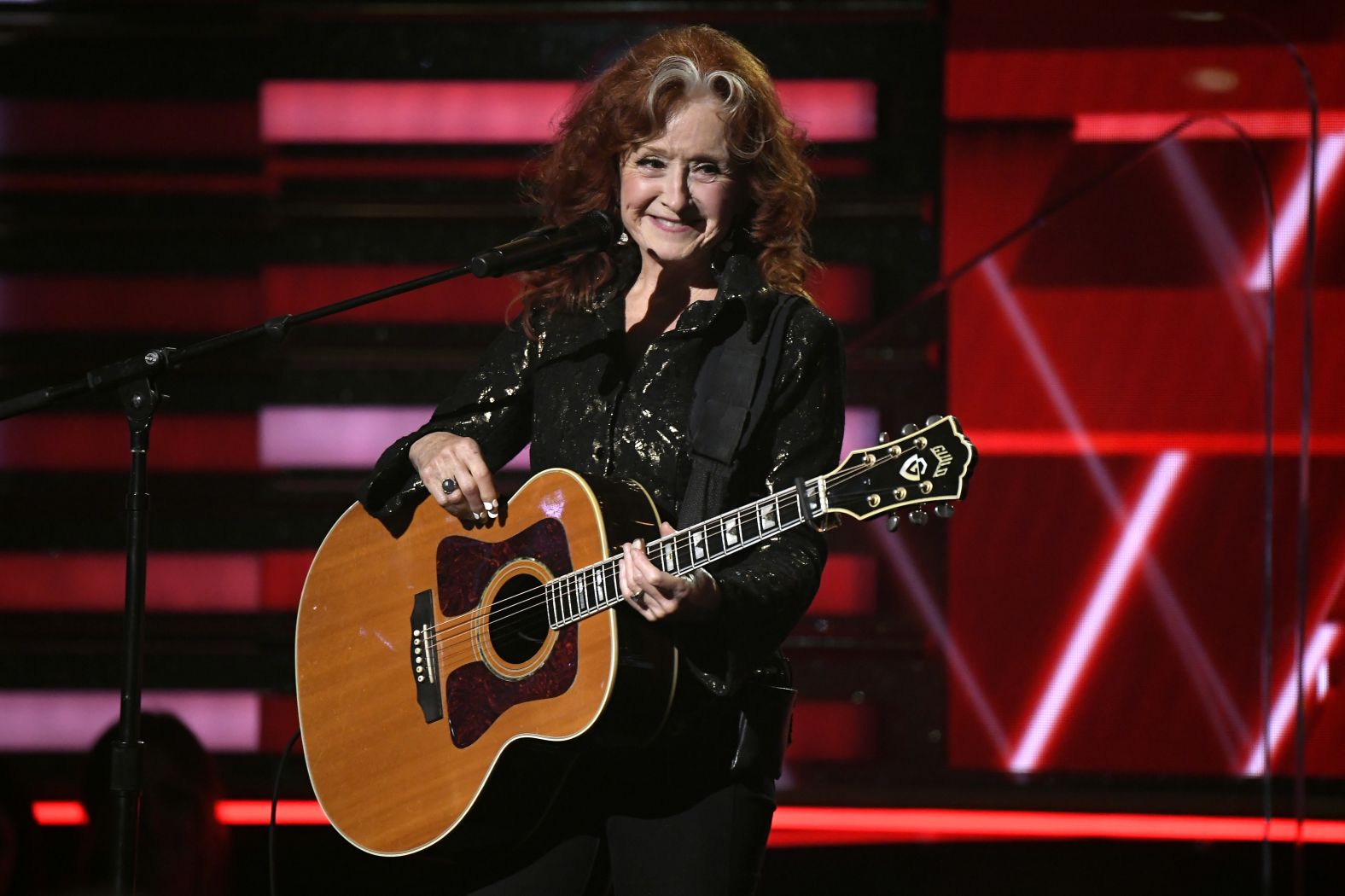 Bonnie Raitt performs onstage.