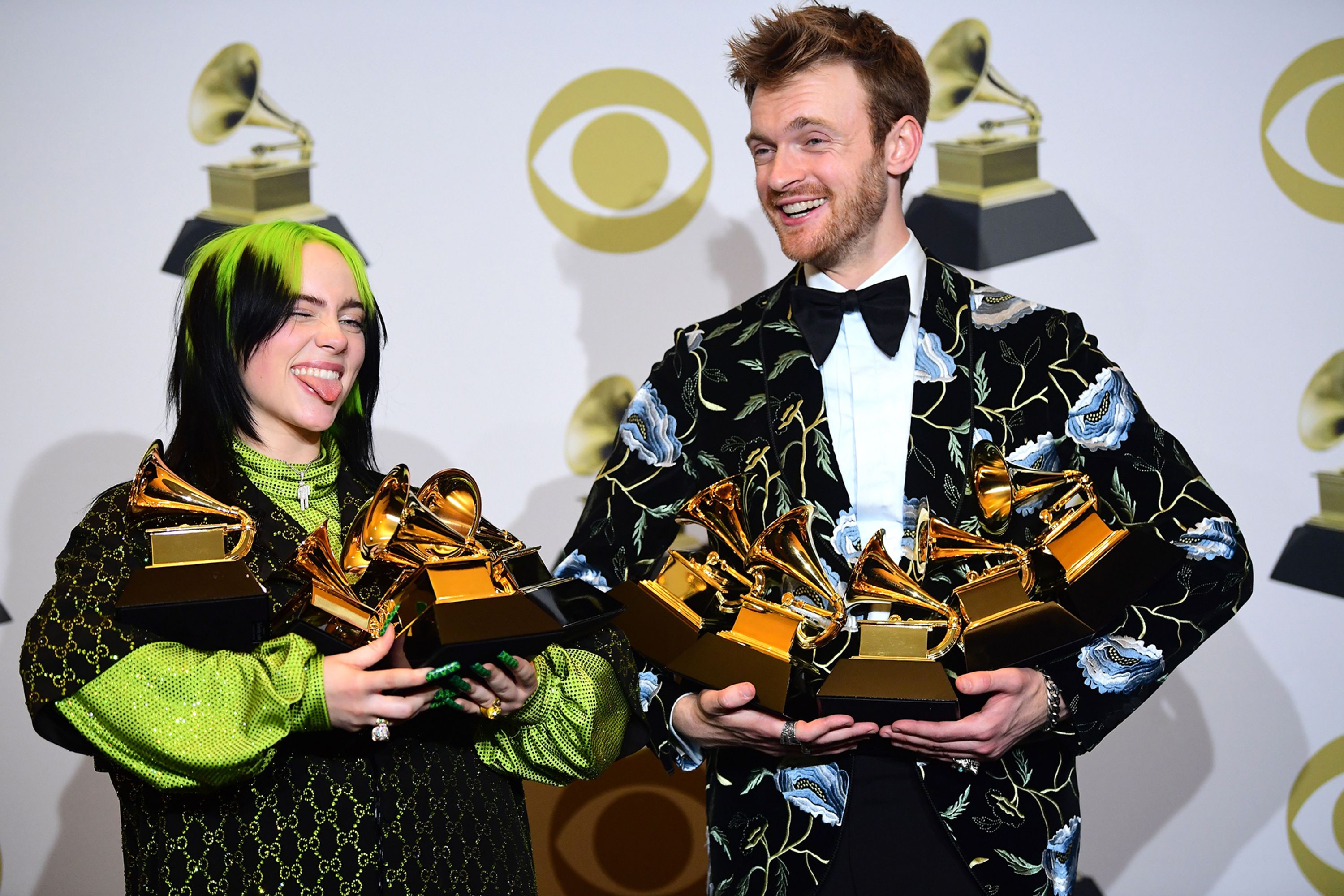 Billie Eilish and her brother and producer Finneas O'Connell pose in the press room with their awards for Album of the Year, Record of the Year, Best New Artist, Song of the Year and Best Pop Vocal Album after the 62nd Annual Grammy Awards on Sunday, January 26. <a  target="_blank">The 18-year-old stole the night after sweeping the four biggest prizes.</a>