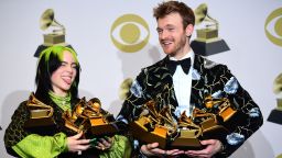 US singer-songwriter Billie Eilish (L) and Finneas O'Connell pose in the press room with the awards for Album Of The Year, Record Of The Year, Best New Artist, Song Of The Year and Best Pop Vocal Album during the 62nd Annual Grammy Awards on January 26, 2020, in Los Angeles. (Photo by FREDERIC J. BROWN / AFP) (Photo by FREDERIC J. BROWN/AFP via Getty Images)