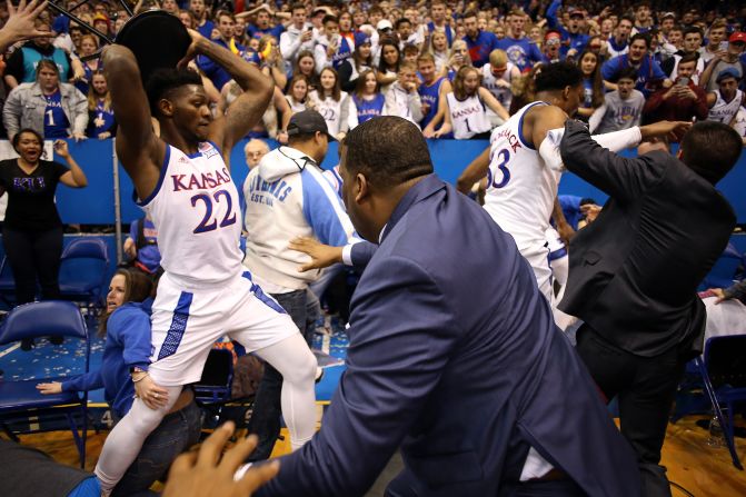 University of Kansas forward Silvio De Sousa grabs a chair during a bench-clearing brawl following a game against rival Kansas State on Monday, January 20, in Lawrence, Kansas. The altercation was sparked after De Sousa blocked Kansas State guard DaJuan Gordon's layup shot shortly before. <a href="index.php?page=&url=https%3A%2F%2Fwww.cnn.com%2F2020%2F01%2F22%2Fus%2Fkansas-jayhawks-fight-de-sousa-suspended%2Findex.html" target="_blank">Four players were suspended</a> by the Big 12 conference.
